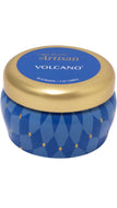 Capri Blue Artisan Volcano 3 oz candle in a blue geometric patterned tin with gold star accents and a metallic gold lid.