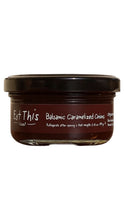 Load image into Gallery viewer, A glass jar of Eat This! Farms Balsamic Caramelized Onions with a dark brown label and black lid, set against a plain white background.
