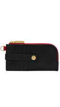 Load image into Gallery viewer, A black leather zip-around card holder wallet with gold-tone hardware, a red zipper track, and a black strap with a gold snap button, shown against a plain white background.
