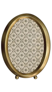 Decorative oval frame with gold border and patterned interior on a white background