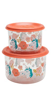Two round plastic storage containers stacked together, featuring a colorful unicorn and floral pattern on a clear body with bright orange lids.